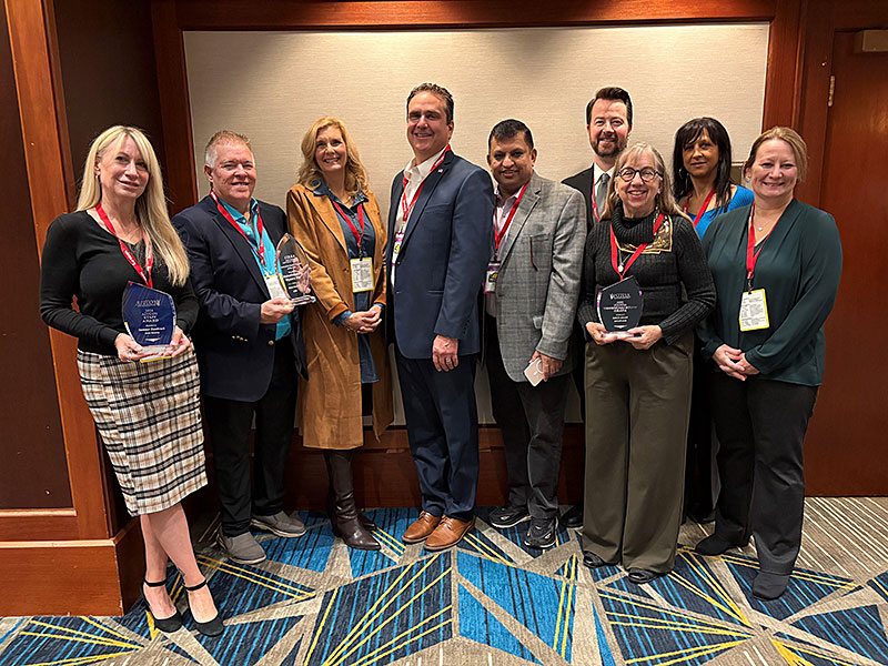 elected officials and staff with awards at conference